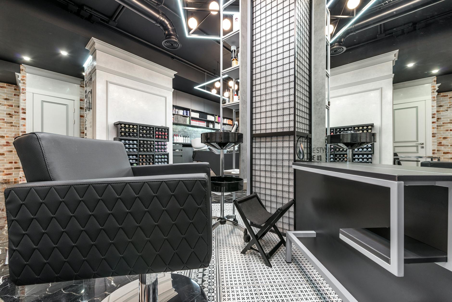 Modern hair salon interior with stylish chairs and warm lighting